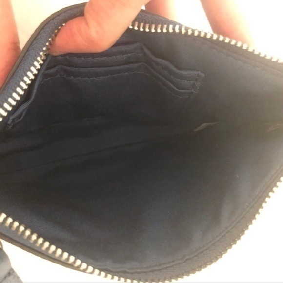 COACH blue leather shearling wristlet clutch